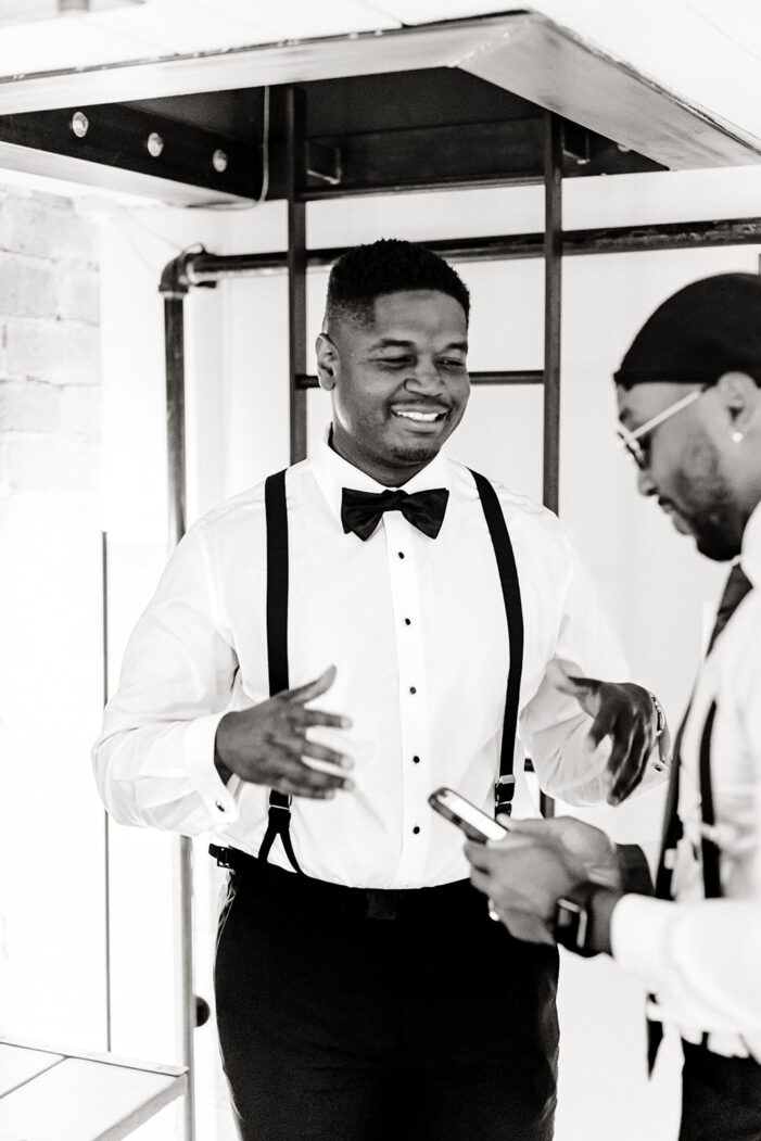 groom gets dressed on wedding day