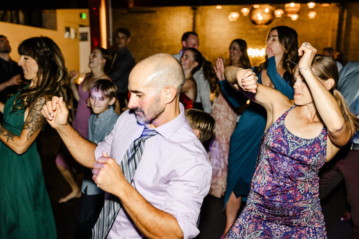 wedding guests dance at Within Sodo wedding reception