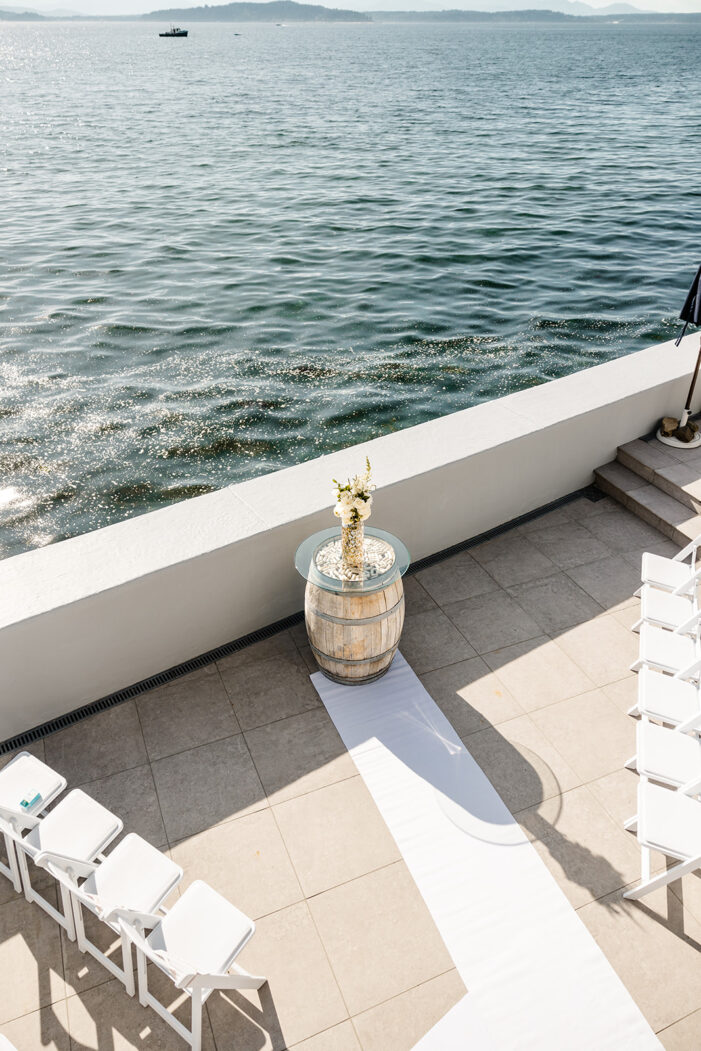ceremony set up on porch overlooking ocean