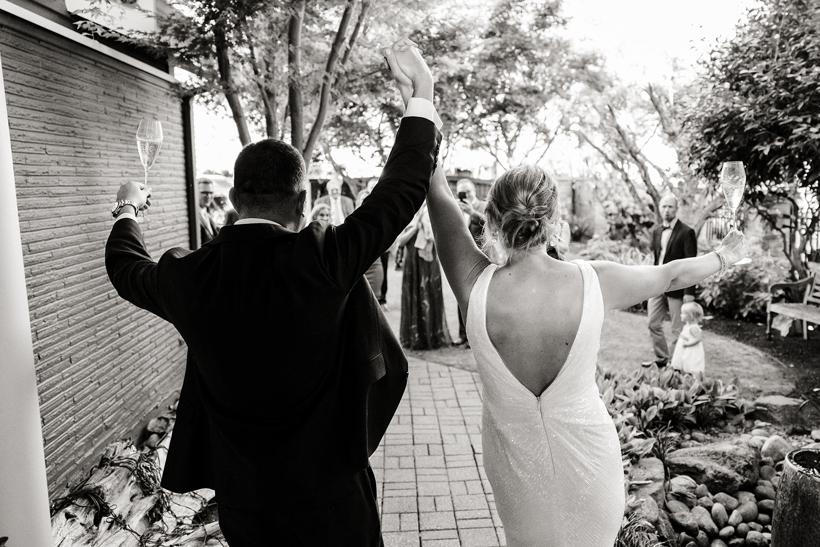 couple celebrating with wine and their guests at wedding, seattle best photographer