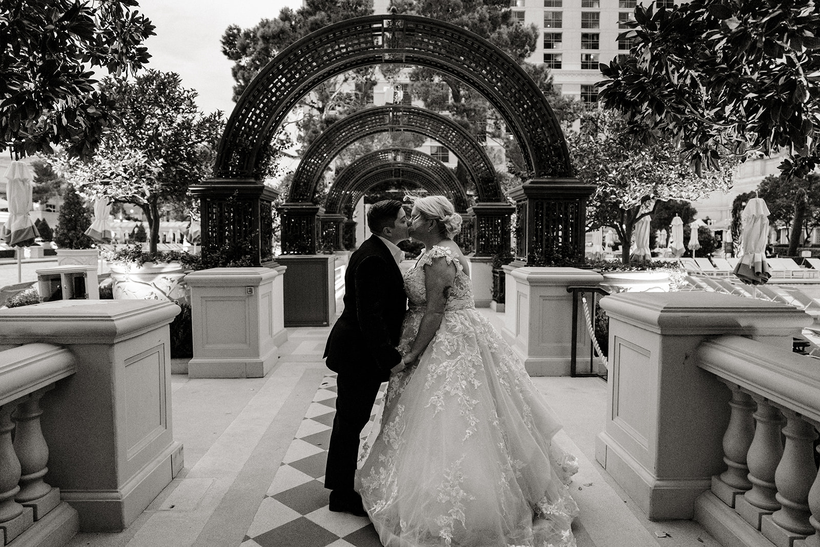 two brides kiss in a vegas garden