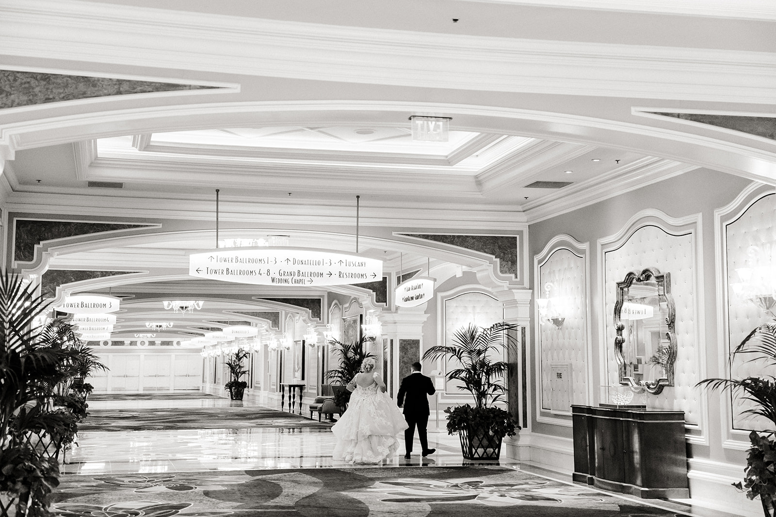 two brides walk through hotel in vegas