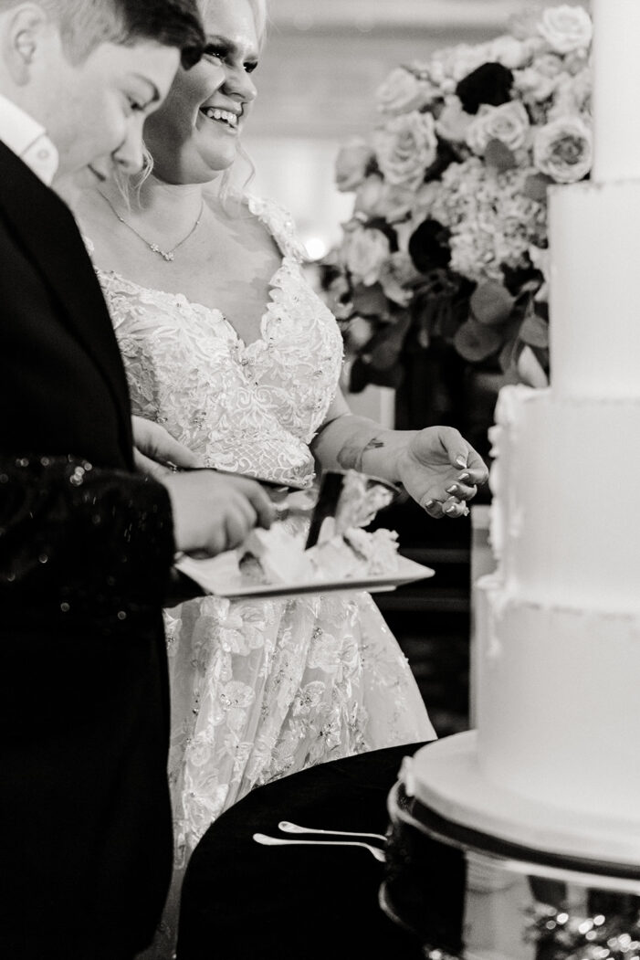 two brides cut cake at vegas wedding