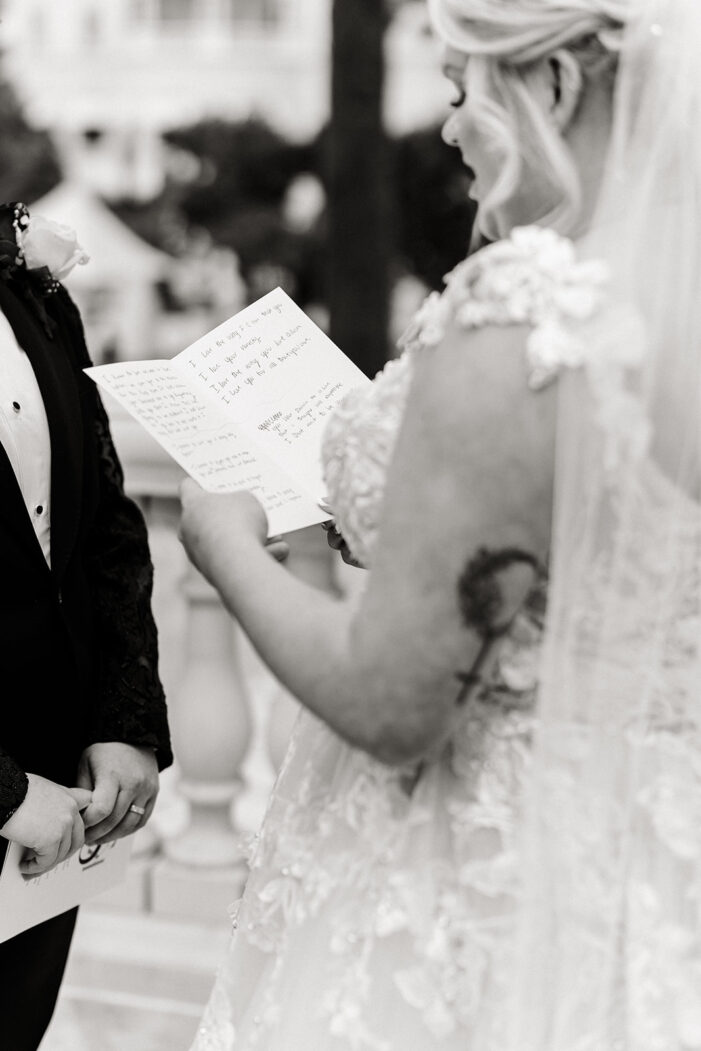 close on vow book behind held in hands