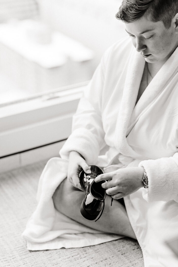 bride looks down at watch