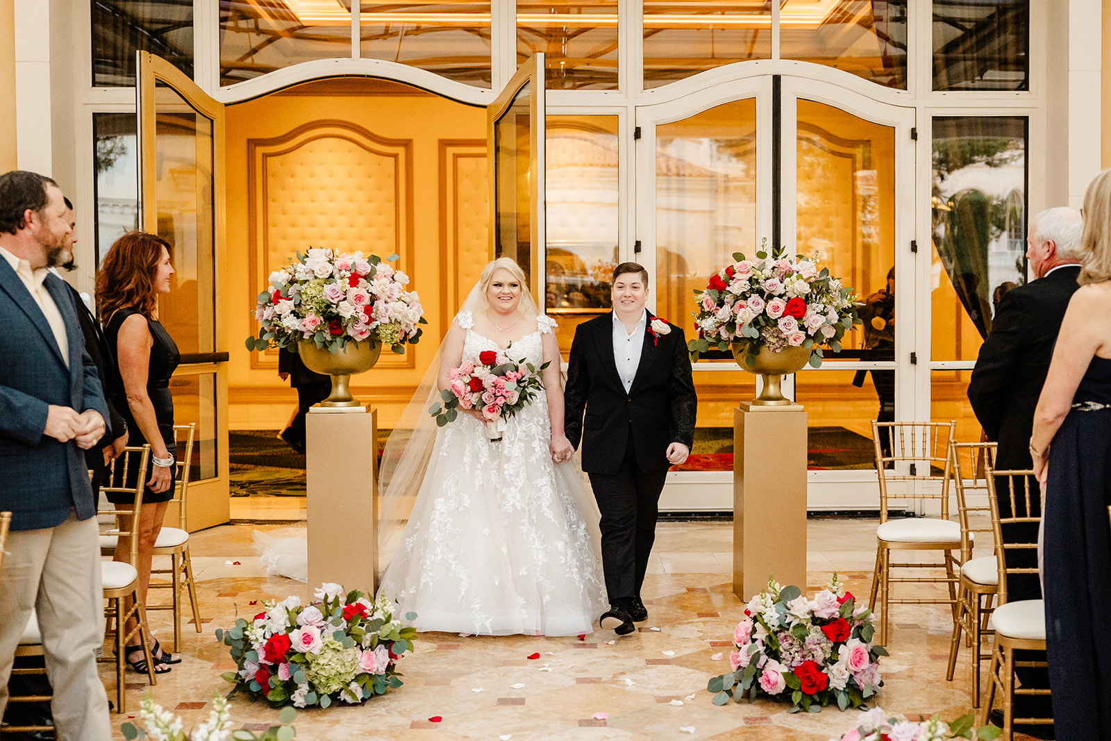 two brides walk out to ceremony at las vegas wedding