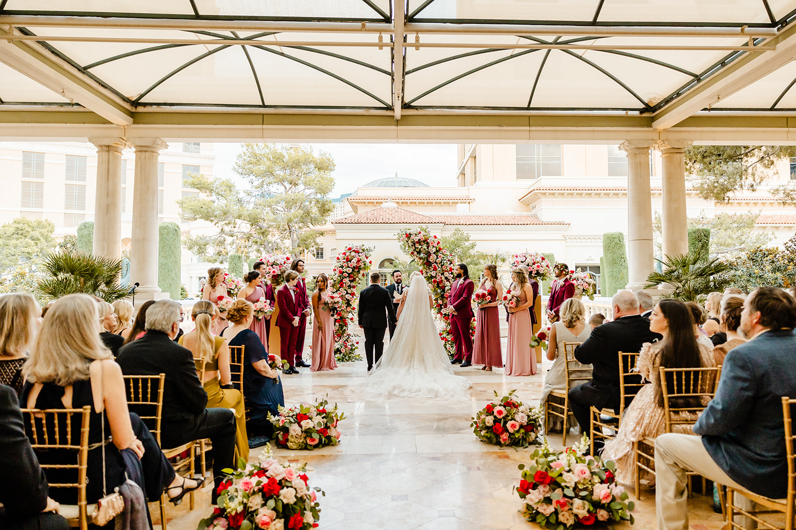 two brides stand at front of ceremony during las vegas wedding