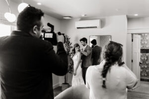 top wedding photo video team in Seattle documents a couple getting ready together in their suite on their wedding day