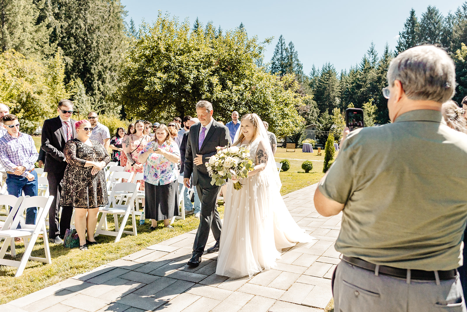 bride walks down aisle with dad
