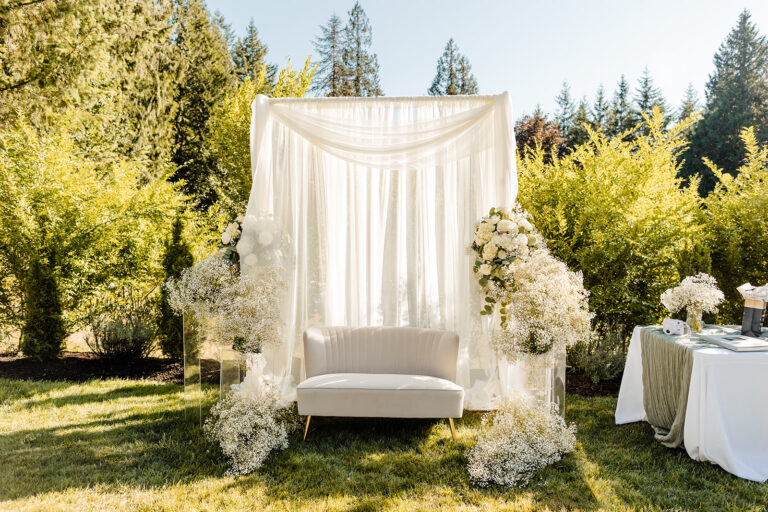 portrait area at wedding with couch and drapery