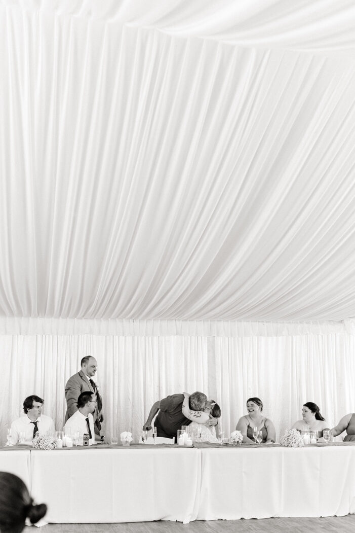 someone giving a speech at a wedding