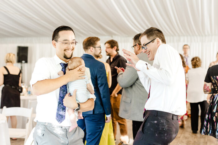 bride dances with guests at evergreen meadows wedding