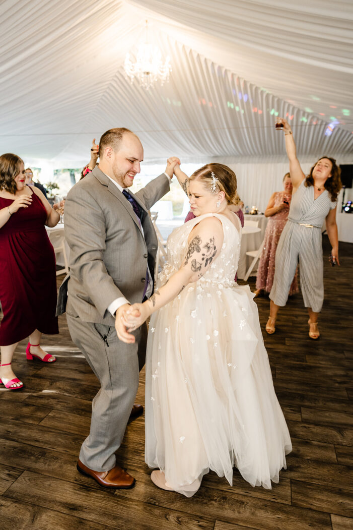 guests dance at evergreen meadows wedding