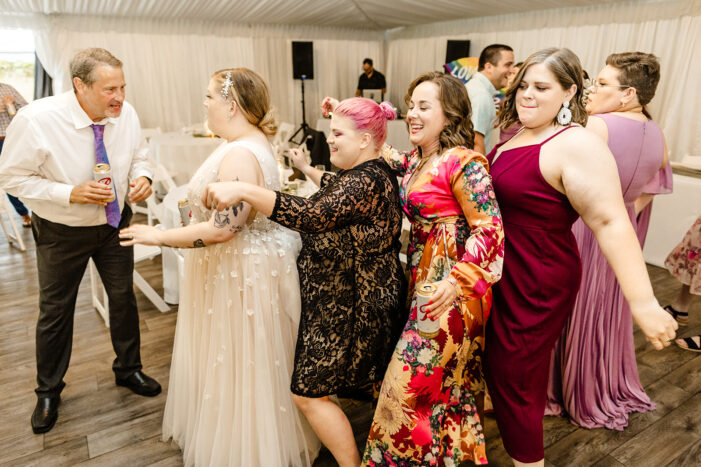 guests dance at evergreen meadows wedding
