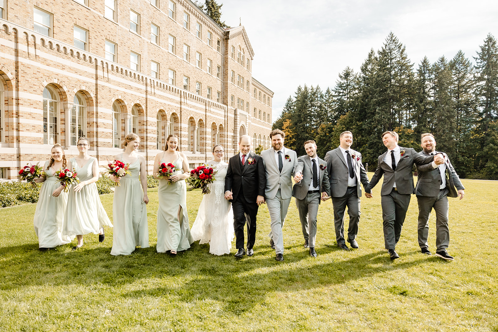 bridal party walks across the lawn