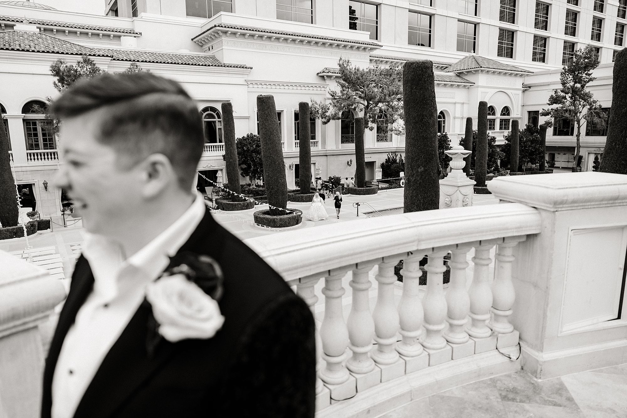 Bellagio wedding photographer captures over the shoulder of two brides getting set up for their first look