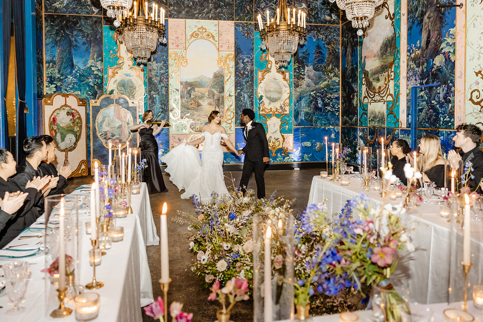bride and groom share first dance in ballroom