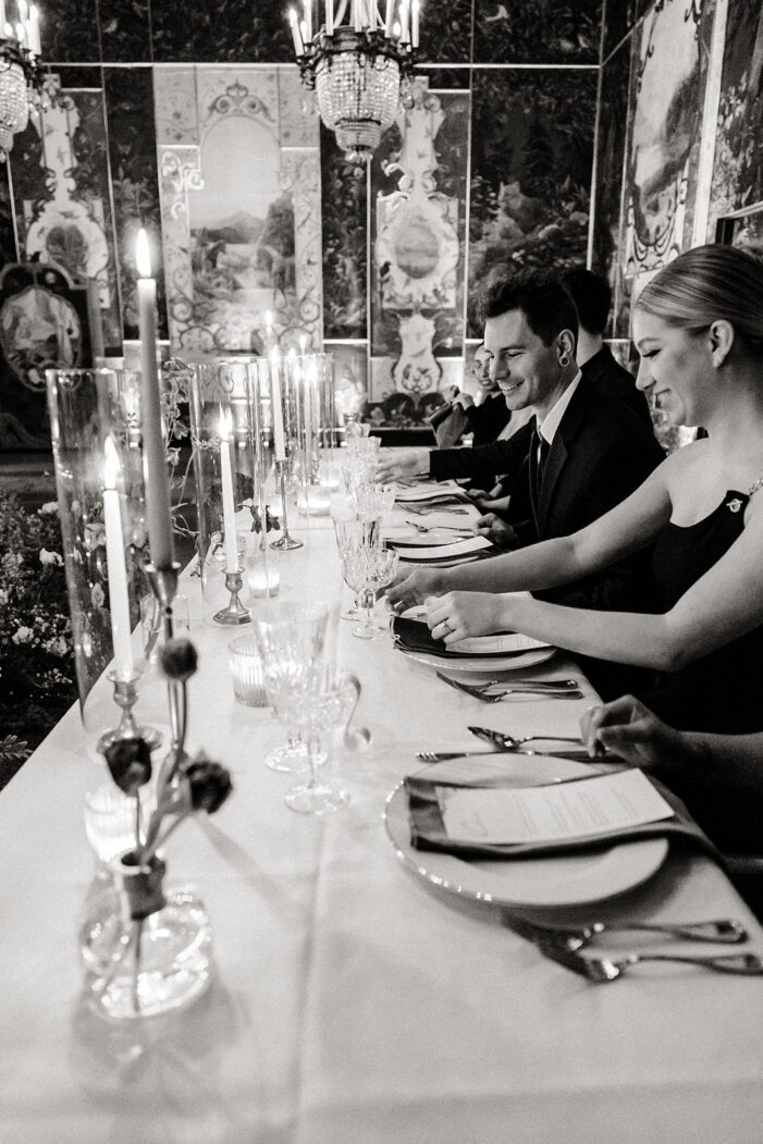 wedding guests sit at reception table