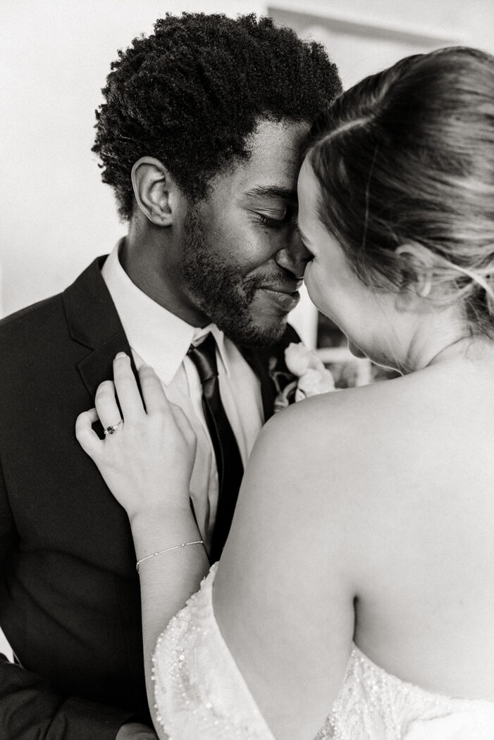 close on bride and groom with their foreheads together