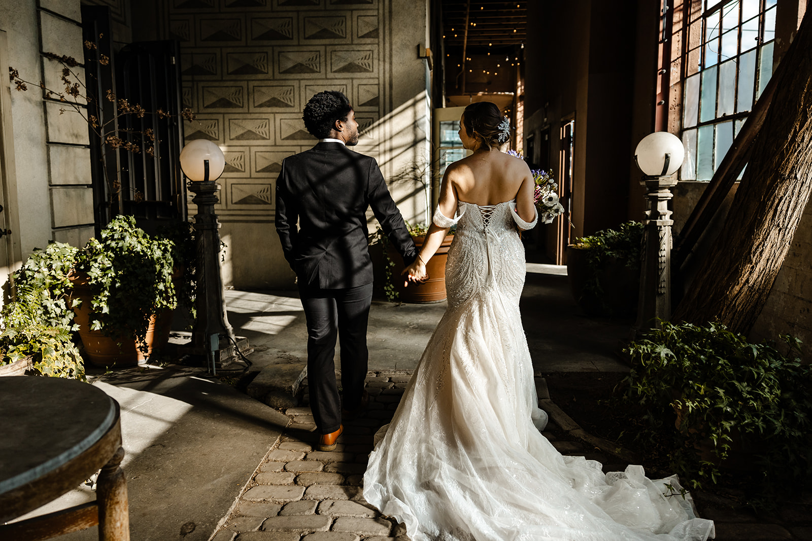 bride and groom walk away