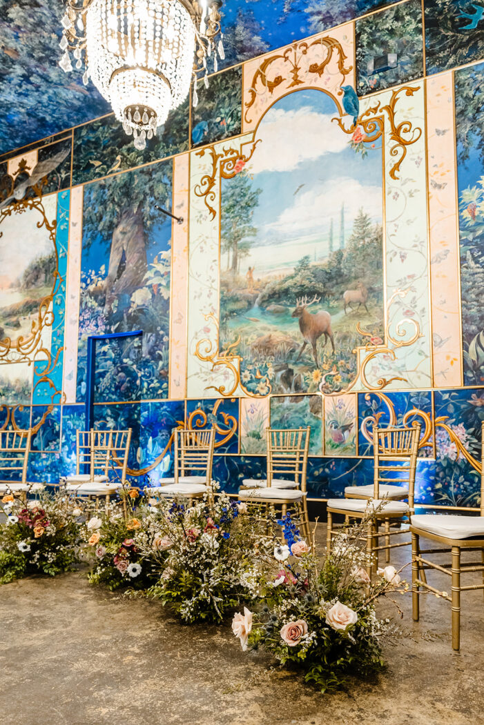 gold chairs set up with florals