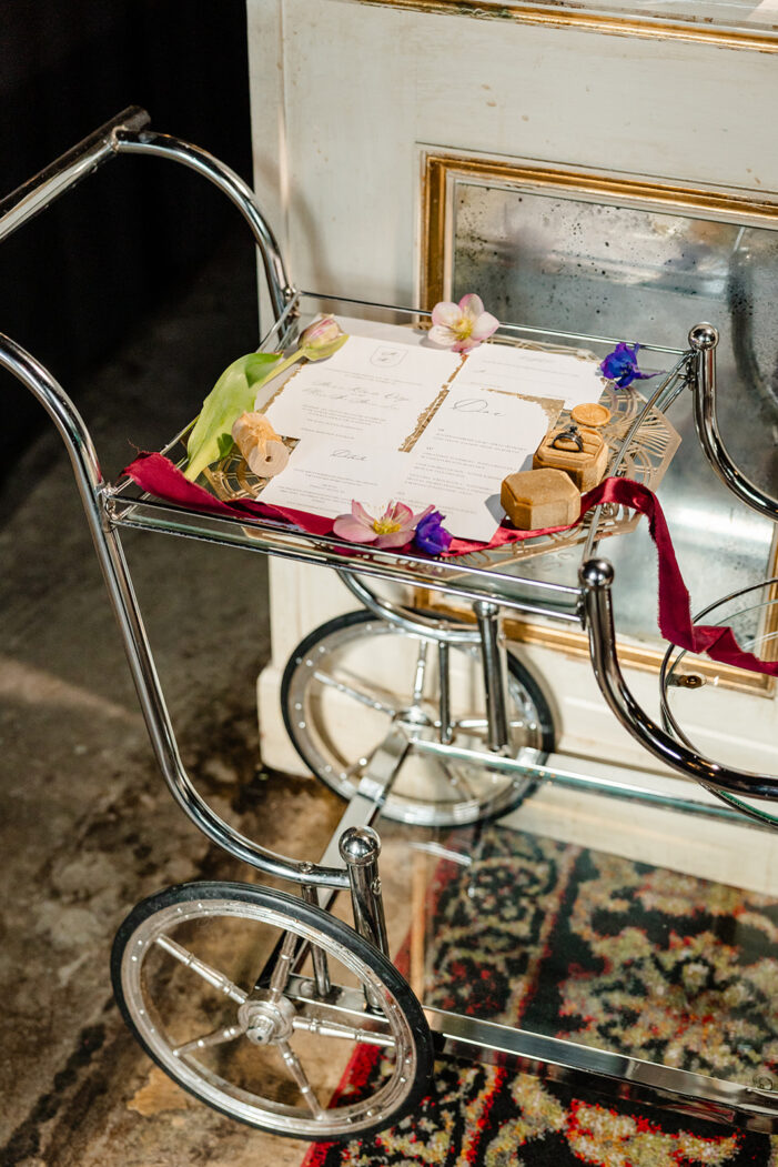 wedding invite suite on top of rolling cart