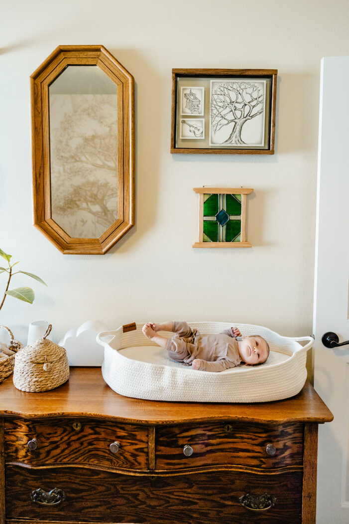 newborn on changing table