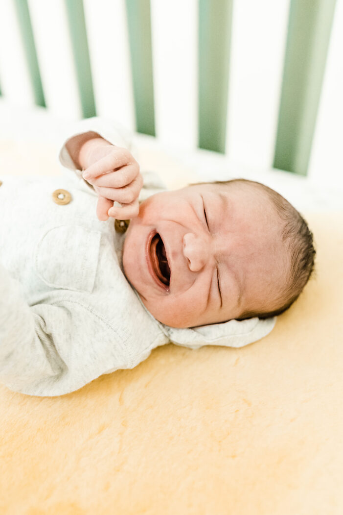 baby cries in crib