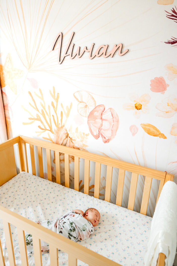 newborn in crib