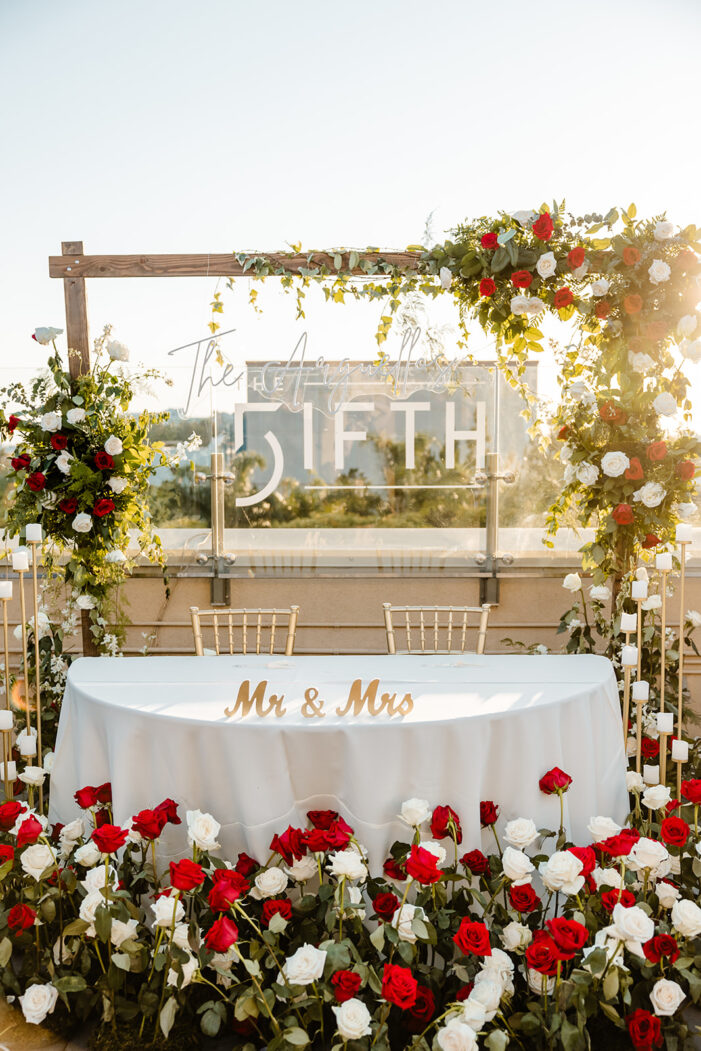 wedding with red and white florals