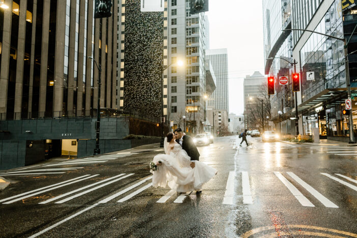 rainy day Seattle Courthouse Elopement couple kissing in the middle of the street