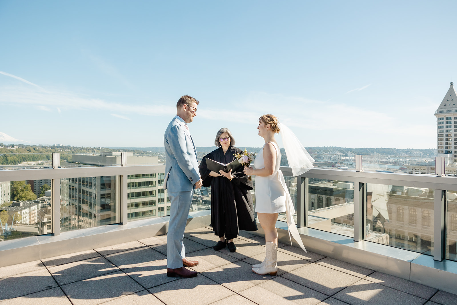 bride and groom on courthouse roof