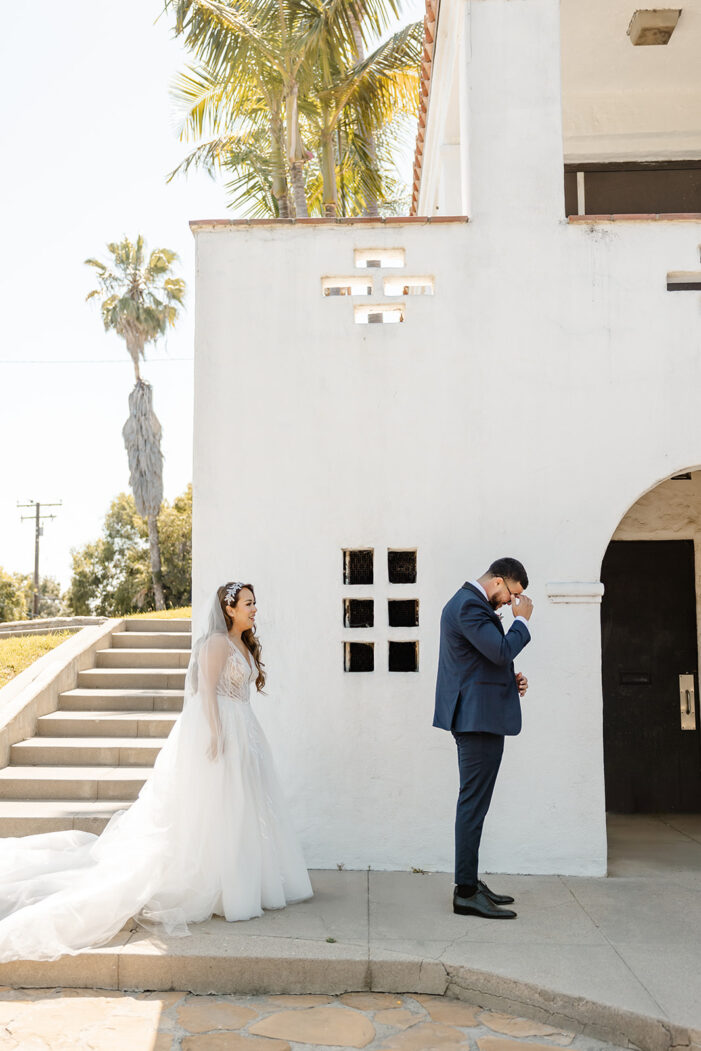 bride approaches groom for first look
