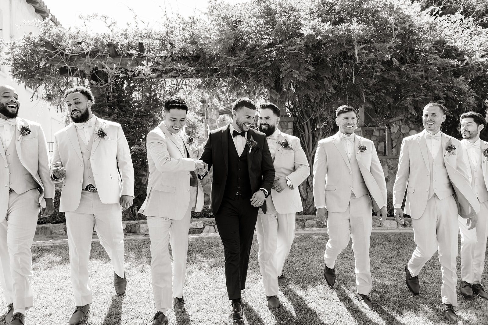 groom walks with his boys