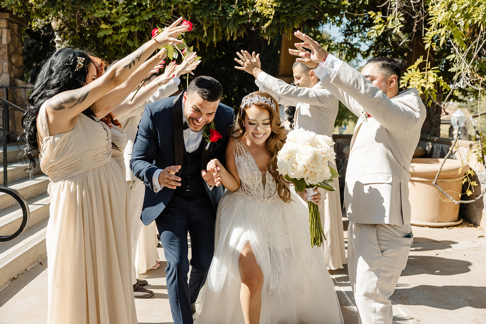 bride and groom run through bridal party tunnel