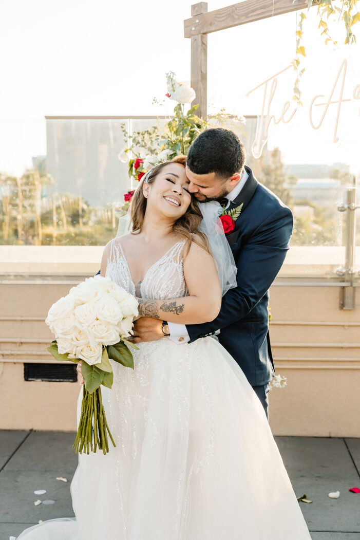 bride and groom embrace