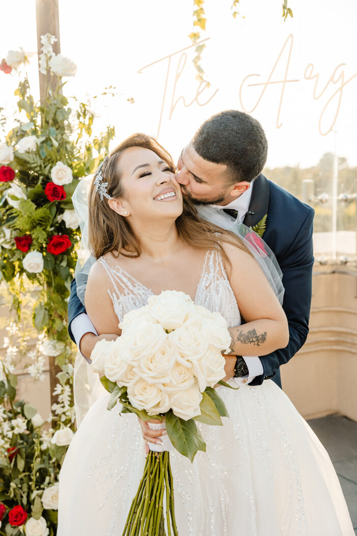 bride and groom embrace