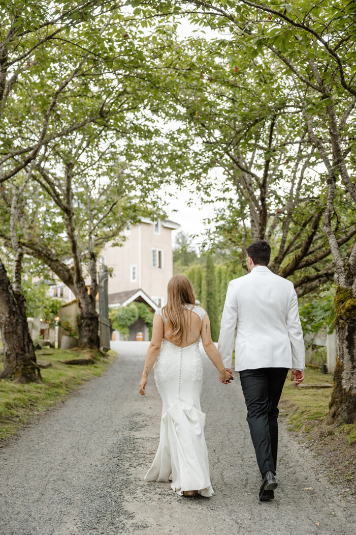 bride and groom in front of Chateau Lill