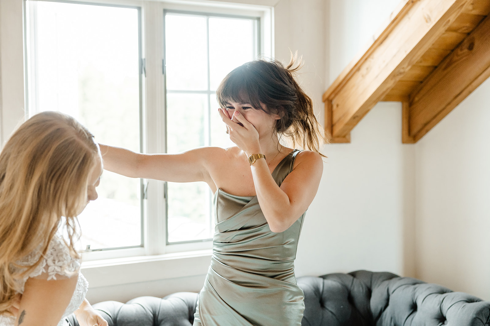 bridesmaid cries looking at bride