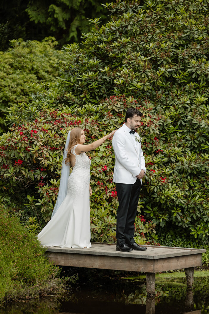 bride taps groom on shoulder