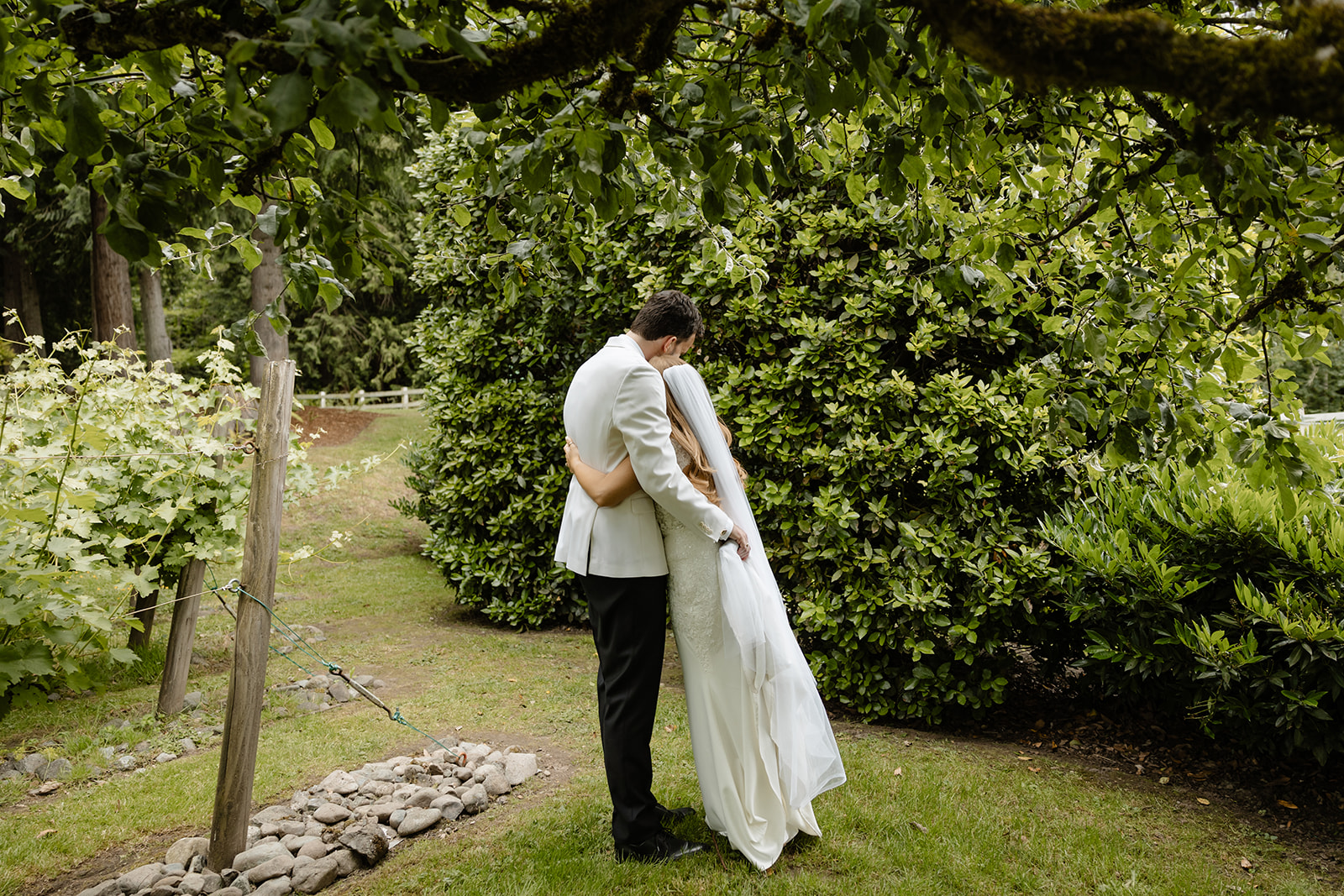 bride and groom embrace at chateau lill
