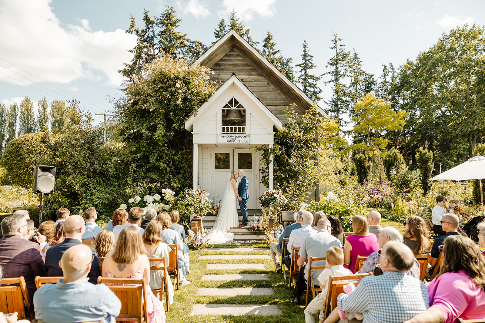 bride and groom kiss at christianson's nursery ceremony
