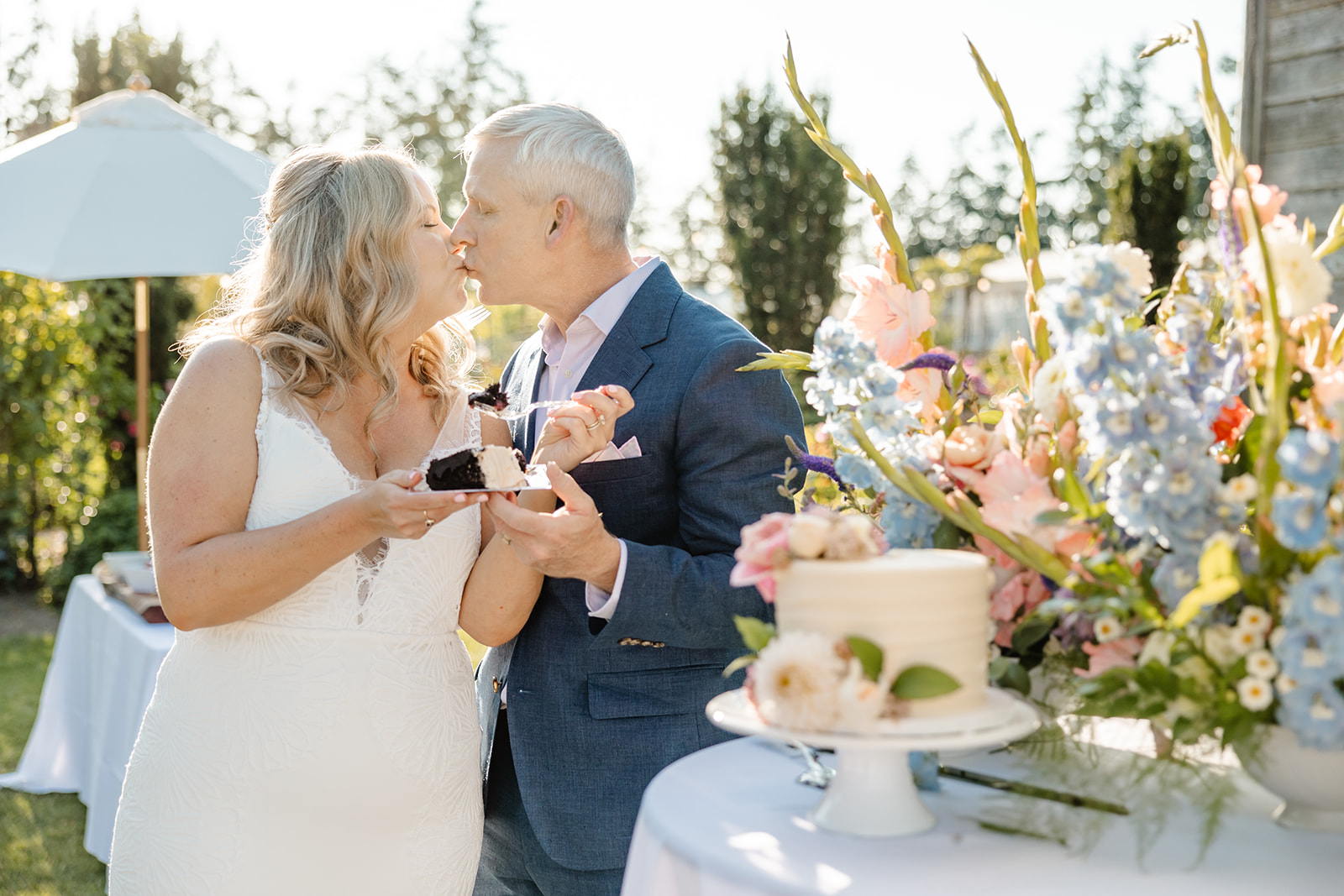 bride and groom cut cake at christianson's nursery