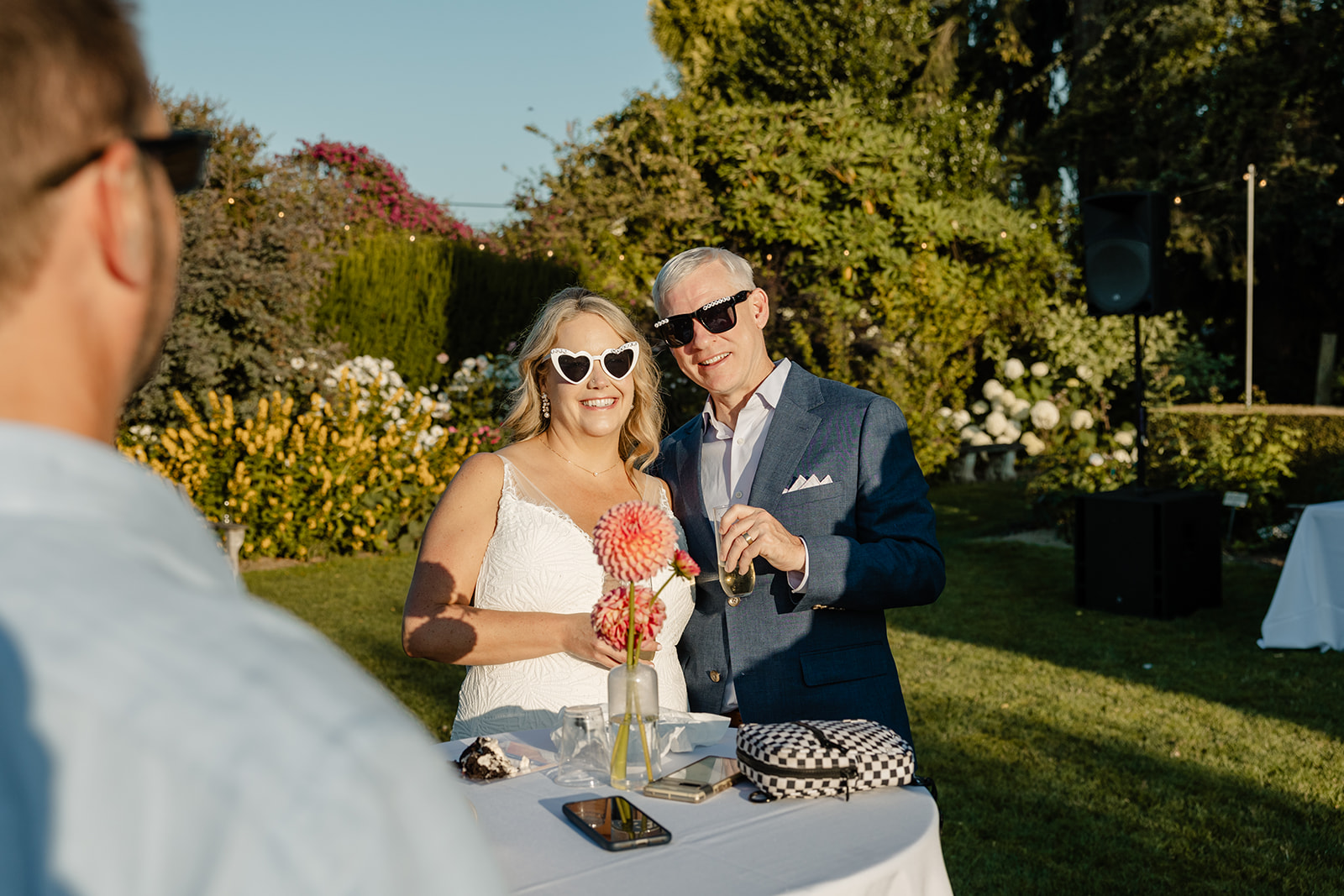 bride and groom wearing sunglasses at wedding reception