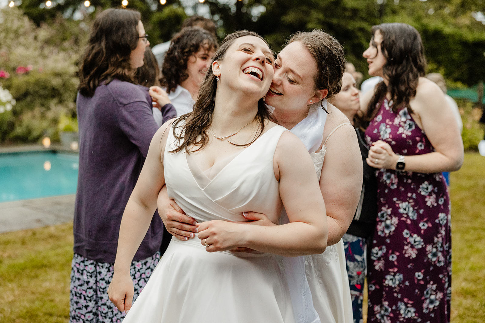 two bride holding each other