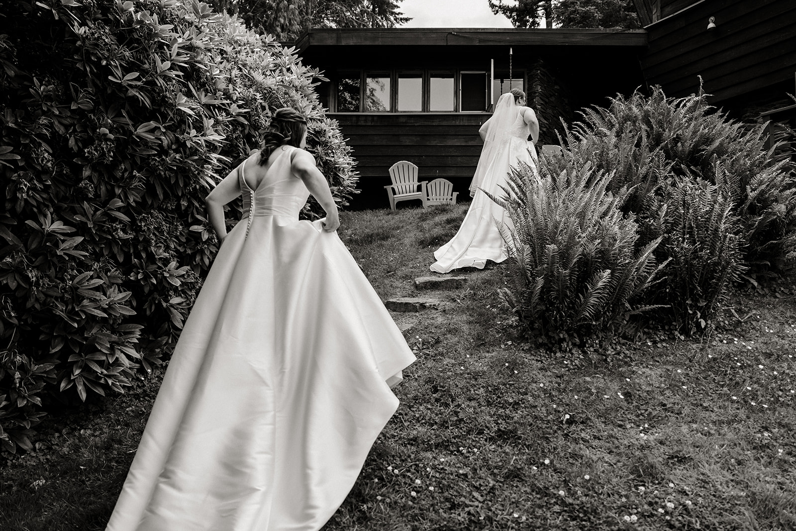 brides walking up towards house