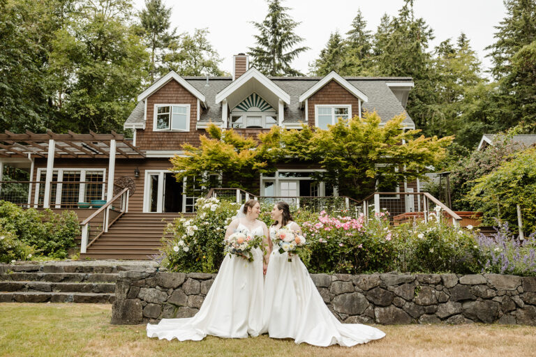 brides standing in front of house