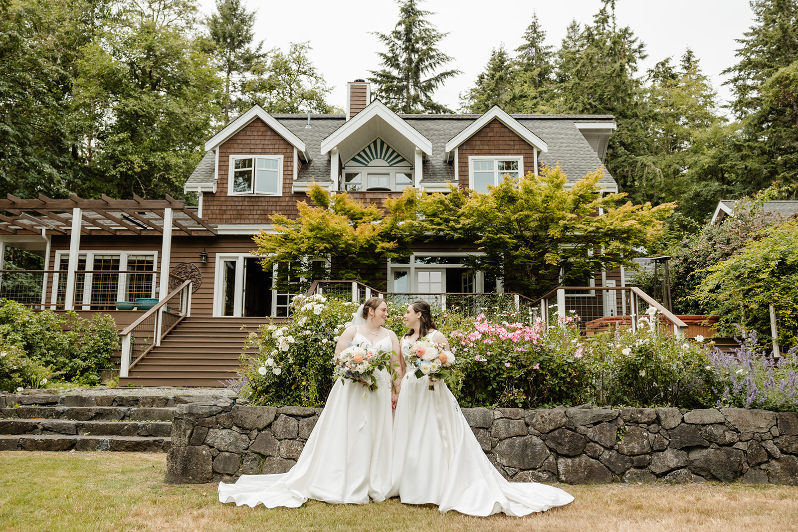 brides standing in front of house