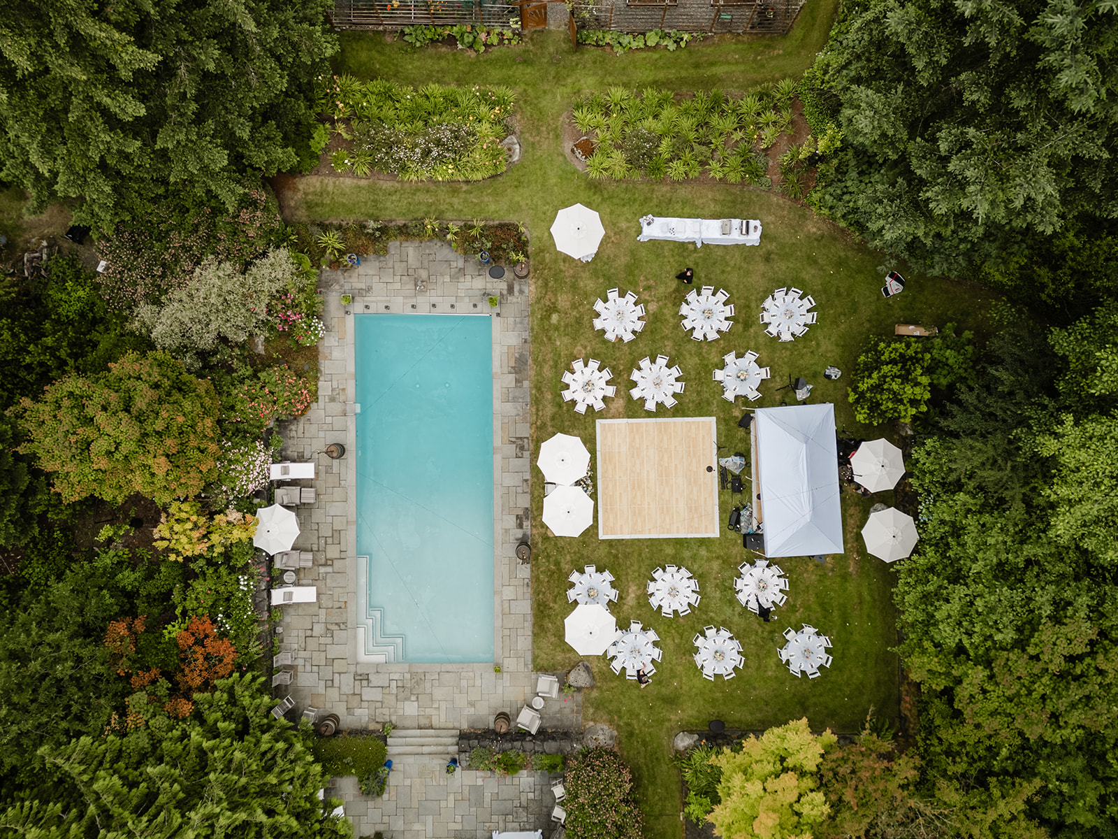 drone shot of pool and wedding reception