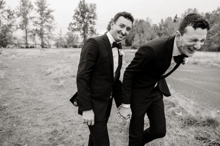 grooms laughing together